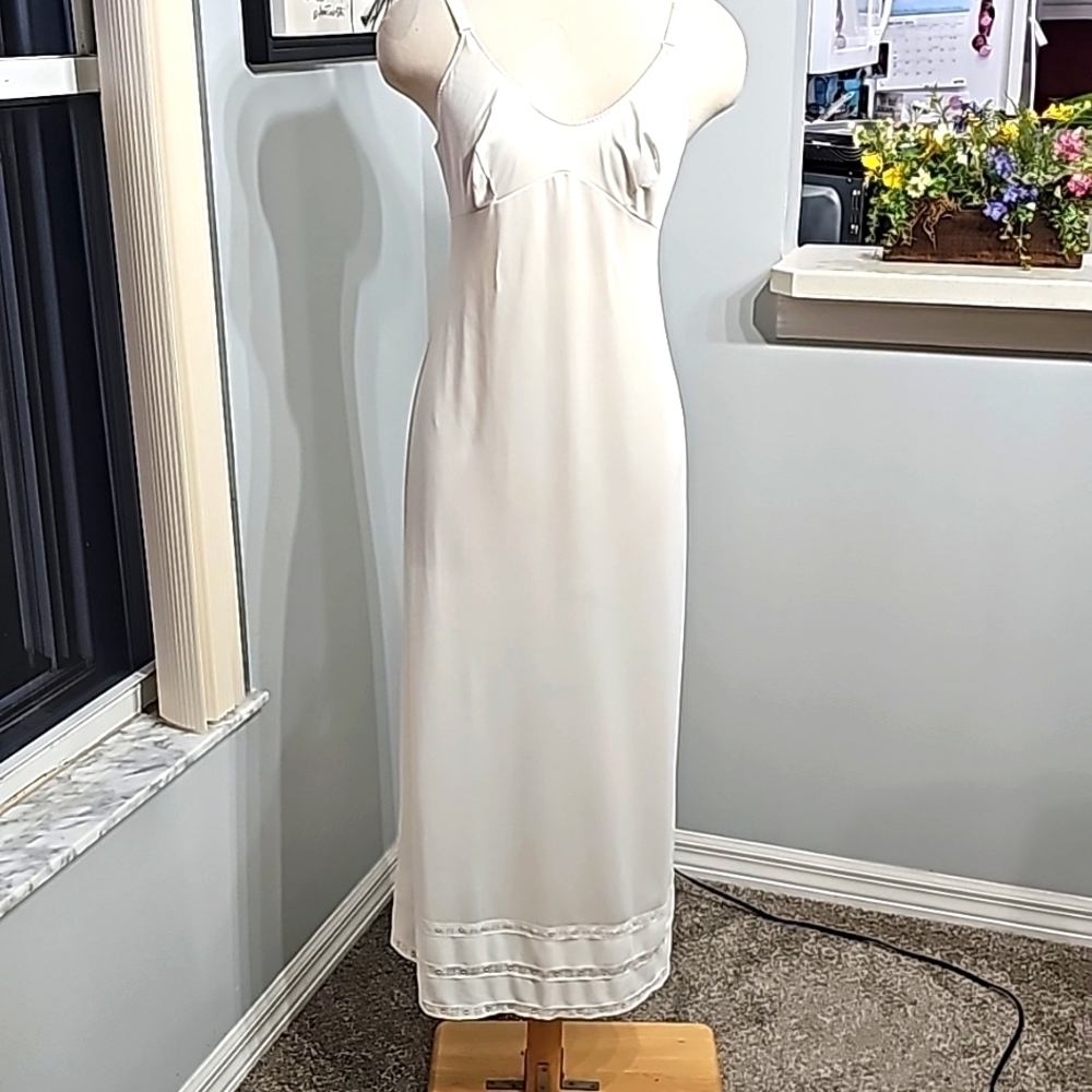 Vintage sears slip. Size 34 formal length. Adjustable straps. Off white.